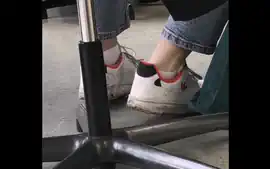 candid feet in white ankle socks and sneakers