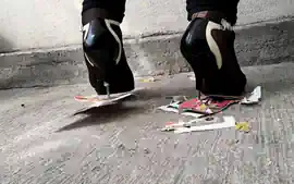 Girl trampling stomping on picture in metal high heels