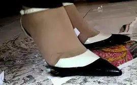 Girl stomping on paper and trampling in metal high heels