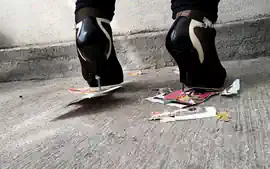 Girl trampling stomping on picture in metal high heels